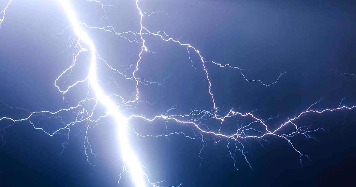 Abstract watercolor of forked lightning splitting a dark sky — a dangerous crisis that can be survived with emergency care