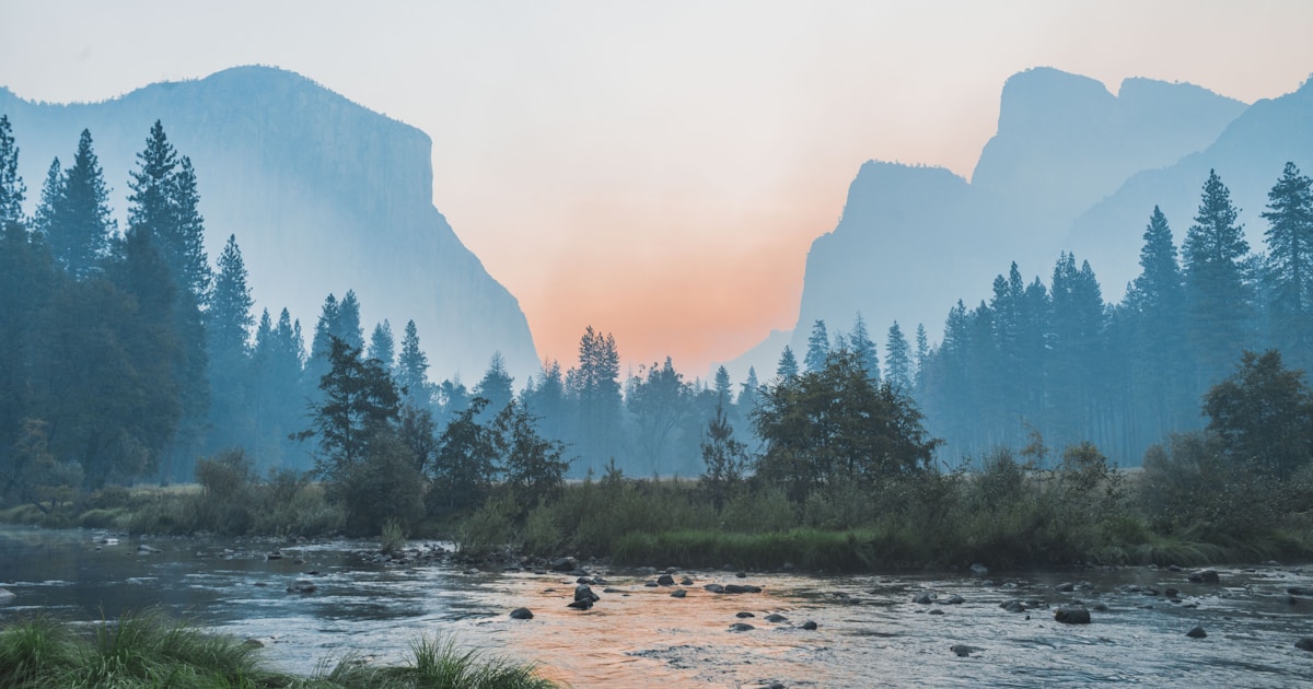 Abstract watercolor of dawn light filling an open mountain valley with a clear river — self-directed, science-based navigation toward recovery
